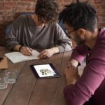 man-wearing-purple-long-sleeved-shirt-looking-at-the-ipad-3184326.jpg